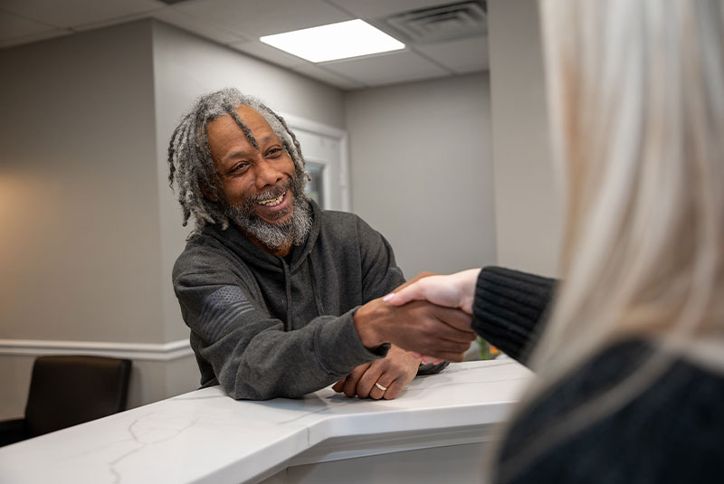 Team member shaking Patients hand